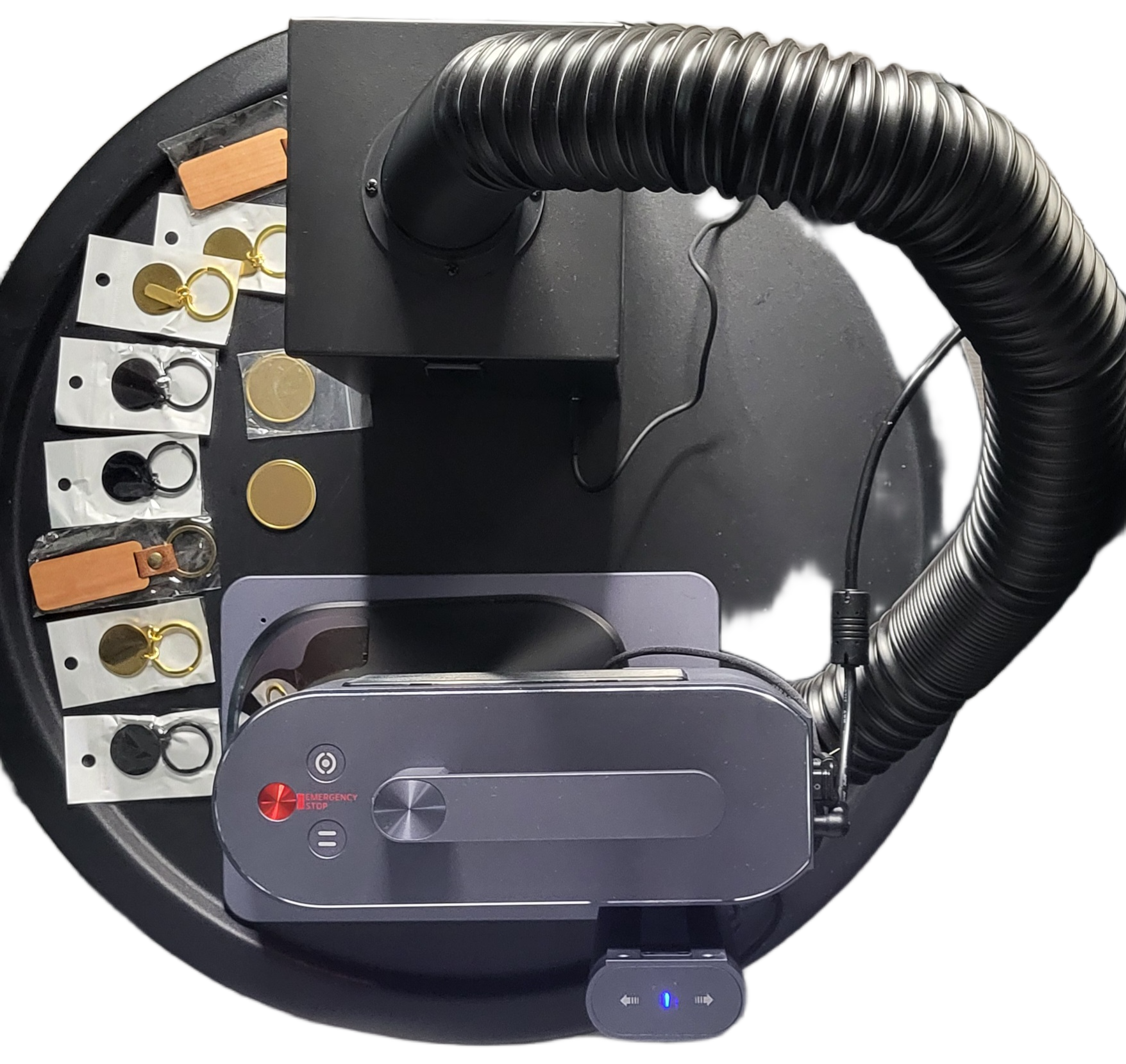 Live laser engraving station with keychains and materials ready for an event